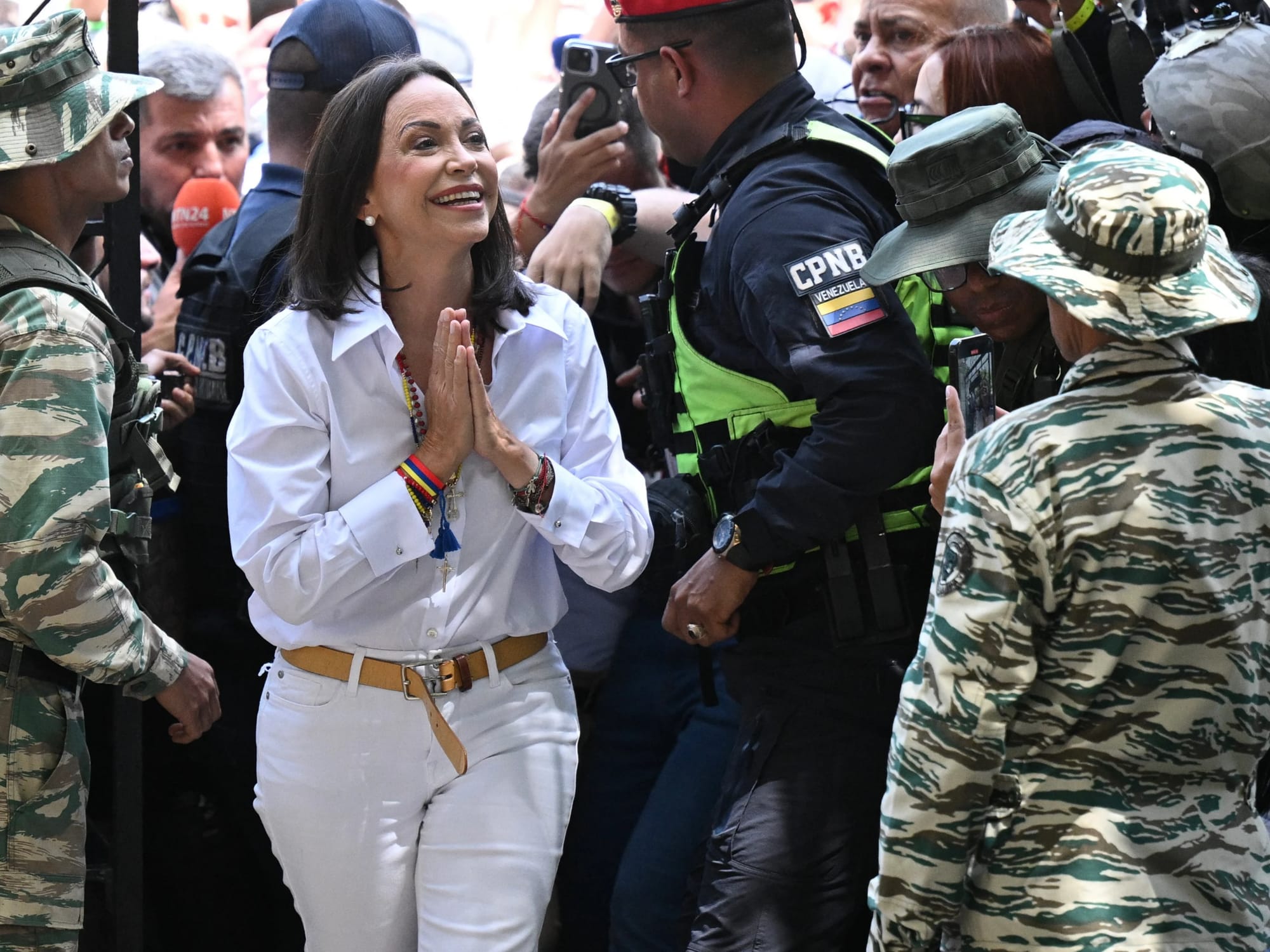 Opposition activist María Corina Machado of Venezuela won the Nobel Peace Prize on Friday. The former opposition presidential candidate in Venezuela was lauded for being a "key, unifying figure in a political opposition that was once deeply divided - an opposition that found common ground in the demand for free elections and representative government," said Jørgen Watne Frydnes, chair of the Norwegian Nobel committee. Above, María Corina Machado arrives at a Caracas polling station on July 28, 2024.

