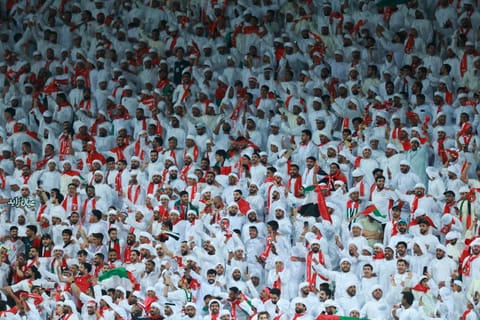 UAE fans cheer during the FIFA World Cup 2026 Asian qualifier football match between United Arab Emirates and Oman at Jassim Bin Hamad Stadium in Doha on October 11, 2025.
