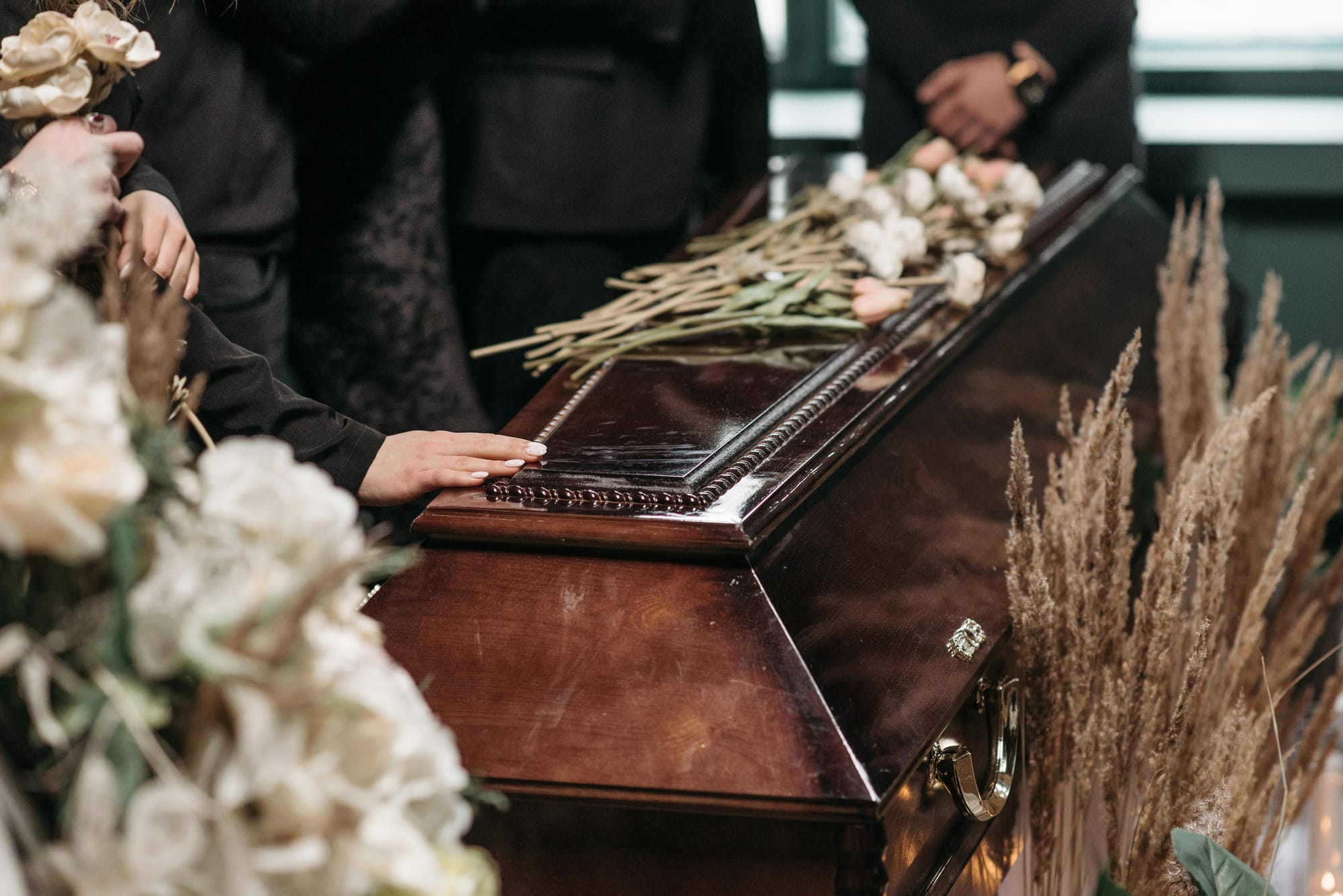 In June 2022, at the funeral of  father-in-law, she noticed an unfamiliar woman among the mourners.