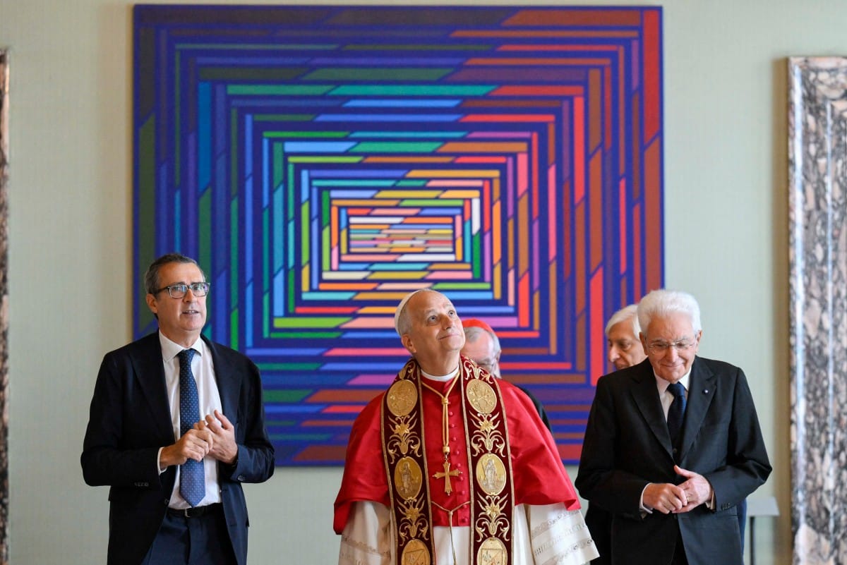 This photo taken and handout on October 14 2025, by The Vatican Media shows Pope Leo XIV (C) and Italy's President Sergio Mattarella (R) during an official visit at the Quirinale Presidential Palace, in Rome.