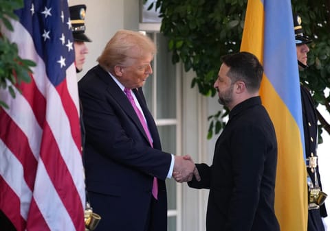 US President Donald Trump (L) greets Ukrainian President Volodymyr Zelensky outside the West Wing of the White House on October 17, 2025, in Washington, DC. 