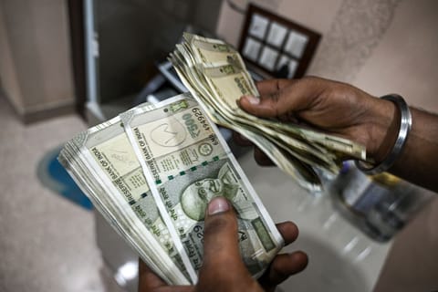 Currency Exchanges in New Delhi as Indian Rupee Falls to Record on Worries About US Tariff Impact