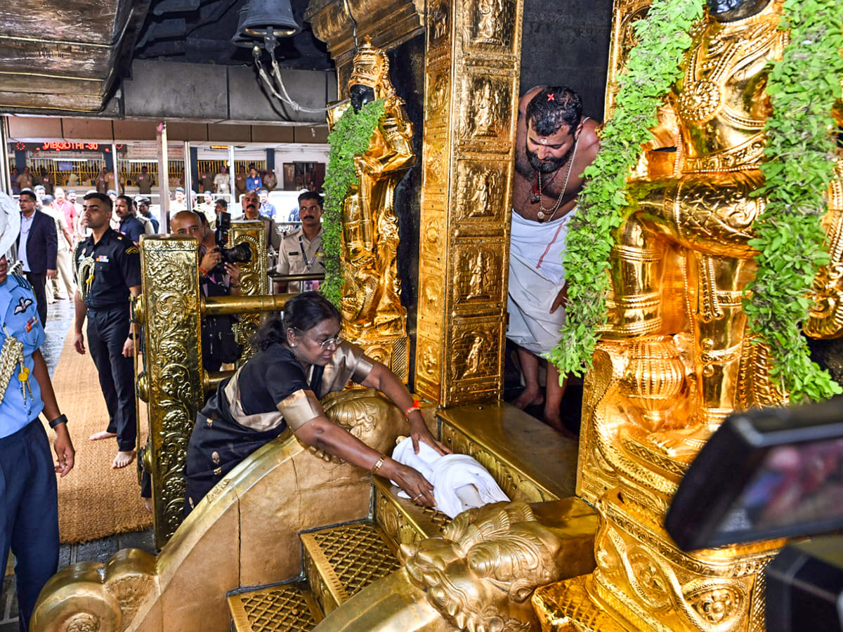 Indian President Droupadi Murmu performs a ritual during her visit to Sabarimala