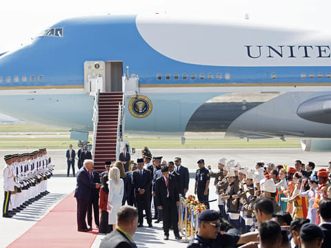US President Donald Trump, left, shakes hands with guests following his arrival at Kuala Lumpur International Airport in Sepang, Selangor, Malaysia, on Sunday, October 26, 2025. 