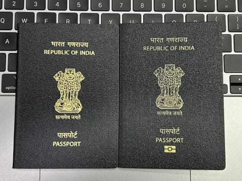 A combo pic showing the existing regular passport on the left and the new ePassport with RFID chip and antenna embedded in it. The ePassport features a gold-colour symbol for the chip. 