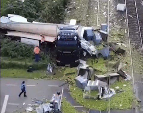 The cargo truck failed to clear the railway crossing in Meteren, central Netherlands, as the barriers descended abruptly. The trailer was violently severed by the impact of the oncoming high-speed train.