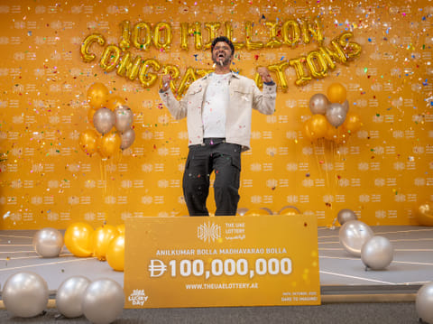 Anilkumar Bolla celebrating his historic win at The UAE Lottery's studio. 