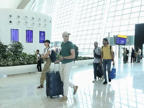 Limited Flights restart at Abu Dhabi airport while thousands of stranded passengers receive support.