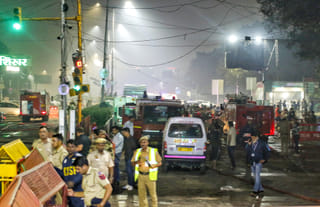 Delhi Police personnel at the site of a car blast near Gate No. 1 of the Red Fort Metro Station, in New Delhi, Monday, November 10, 2025.