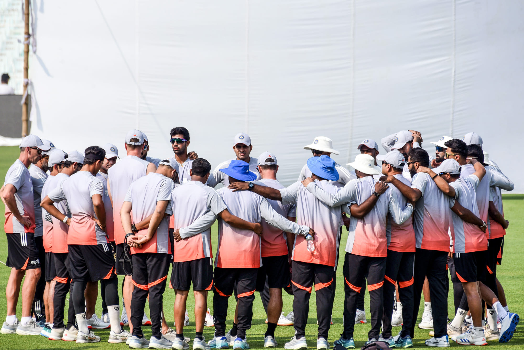 Indian team cuddle up after a training session in Kolkata.