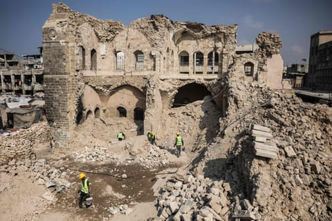 Workers start the rehabilitation on what remains of the Pasha Palace Museum, damaged by two years of fighting between Israel and Hamas, in Gaza City on November 11, 2025.  