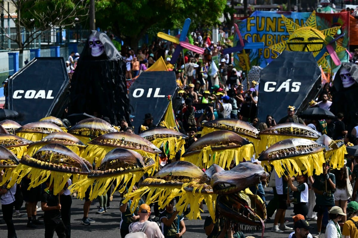 Activists perform the death of fossil fuels at the so-called "Great People's March" in the sidelines of the COP30 UN Climate Change Conference in Belem, Para State, Brazil. File photo taken on November 15, 2025.
