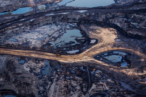 Aerial view of an open-pit oil sands mine in the Athabasca region of northeastern Alberta, Canada.
