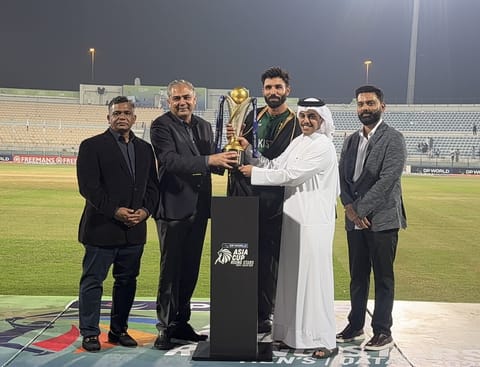ACC President Mohsin Naqvi hands over Asia Cup Rising Stars trophy to Pakistan Shaheens captain Irfan Khan Niazi.