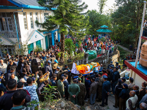 Indian Air Force personnel and relatives carry the casket containing the remains of Wing Commander Namansh Syal, who died in the Tejas plane crash at Dubai Airshow 2025 on Friday, for his final rites at his village near Dharamshala, India, on Sunday, November 23, 2025. 