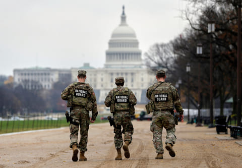 National Guard patrol along the National Mall in front of the Capitol, Wednesday, Nov. 26, 2025, in Washington. 