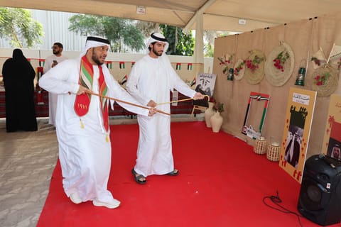 Gulf News staff celebrate Eid Al Etihad in the office premises.