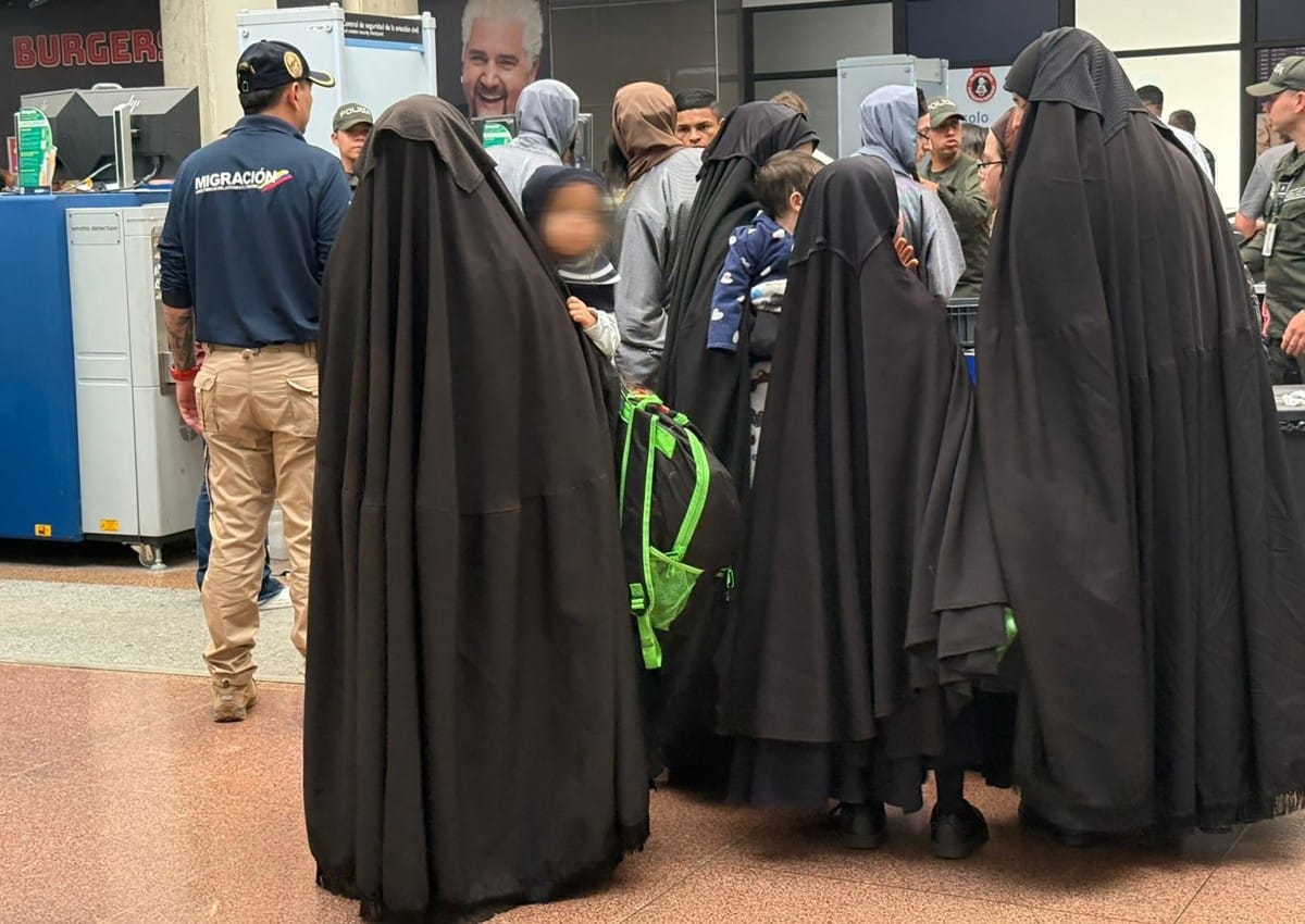 Handout picture released by Migration Colombia Press Office shows members of the Lev Tahor community being expelled from the country to later be handed to US authorities in Medellin, Colombia on December 1, 2025.