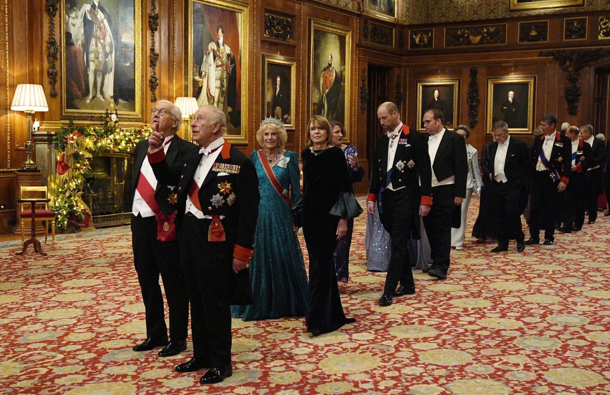 Germany's President Frank-Walter Steinmeier and Britain's King Charles III, followied by Britain's Queen Camilla and Elke Buedenbender and then Britain's Catherine, Princess of Wales and Britain's Prince William, Prince of Wales lead guests as they arrive to attend a State Banquet at Windsor Castle in Windsor, on December 3, 2025, the first day of a three day state visit by the German President.