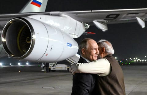 Putin is welcomed by Indian Prime Minister Narendra Modi upon the Russian leader's arrival at Palam Air Force Base in New Delhi on December 4, 2025, the first day of his two-day state visit to India.