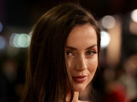 Ana De Armas poses on the red carpet during the opening ceremony of the 5th edition of the Red Sea Film Festival in Jeddah, Saudi Arabia, on December 4, 2025.
