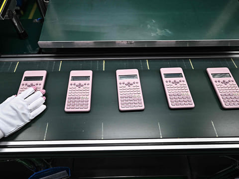 Workers assembling calculators at the Casio factory in Thailand's Nakhon Ratchasima province.