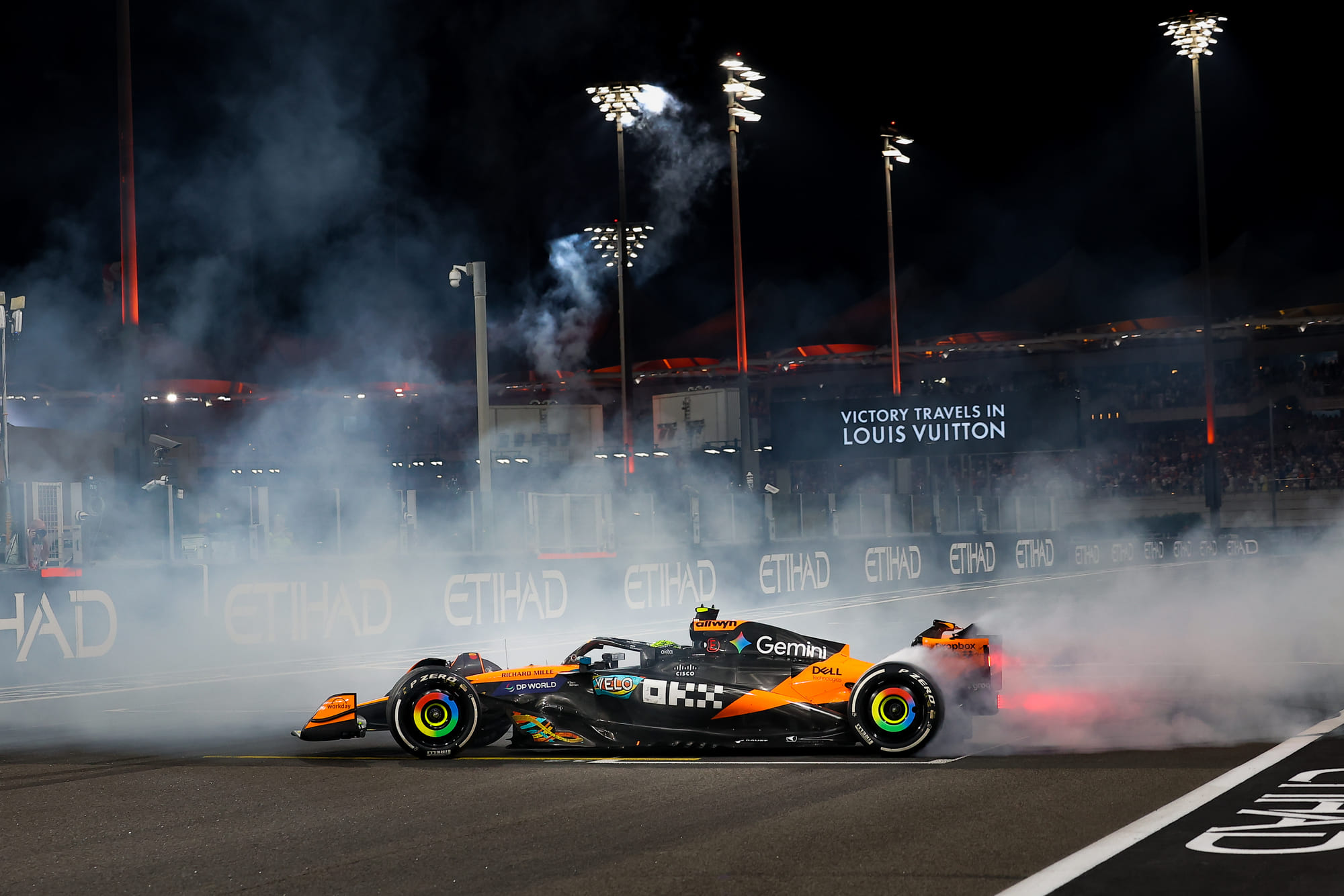 McLaren's Lando Norris performing donuts after winning his first Formula 1 drivers' championship at the Formula 1 Etihad Airways Abu Dhabi Grand Prix 2025.