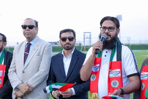 Organiser of the Eid Al Etihad Festival in Ajman Naveed Ahmed (R) speaking at the event.