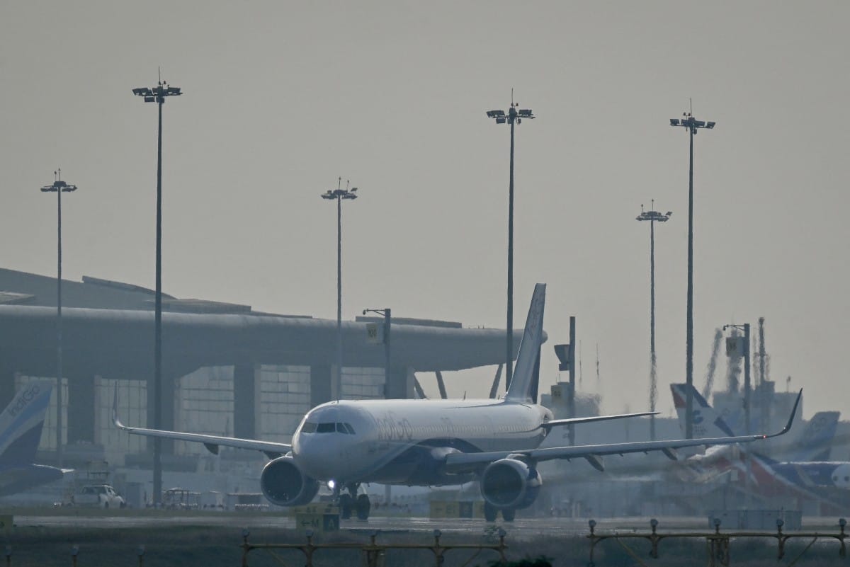 An IndiGo Airlines aircraft prepares to take off at Kempegowda International Airport on a hazy day in Bengaluru on December 9, 2025.