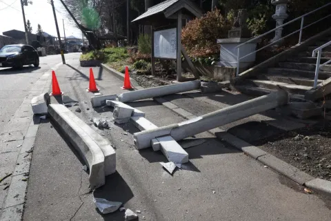 A torii gate at the entrance of Yasaka Shrine is seen after it collapsed in Hachinohe City in Aomori Prefecture, Japan, on December 9, 2025, following a 7.5 magnitude earthquake [JIJI Press/AFP]

