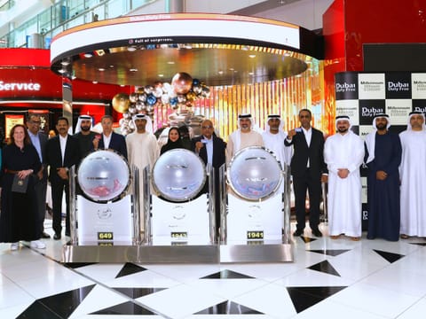 Dubai Duty Free officials announce the latest Finest Surprise draw winners.