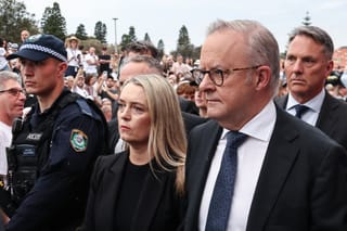 Australia falls silent, lights candles for Bondi Beach shooting victims