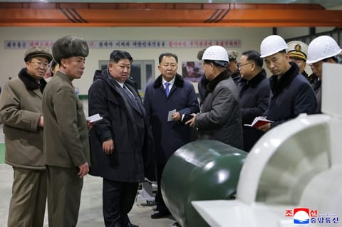 North Korean leader Kim Jong Un visits the manufacturing site of an 8,700-tonnage nuclear-powered strategic guided missile submarine at an undisclosed location in North Korea.
