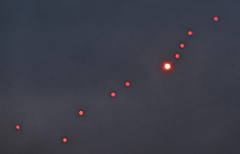 This photograph taken on December 27, 2025 shows Ukrainian air defence firing at drones during a Russian drones and missiles attack, in Kyiv.