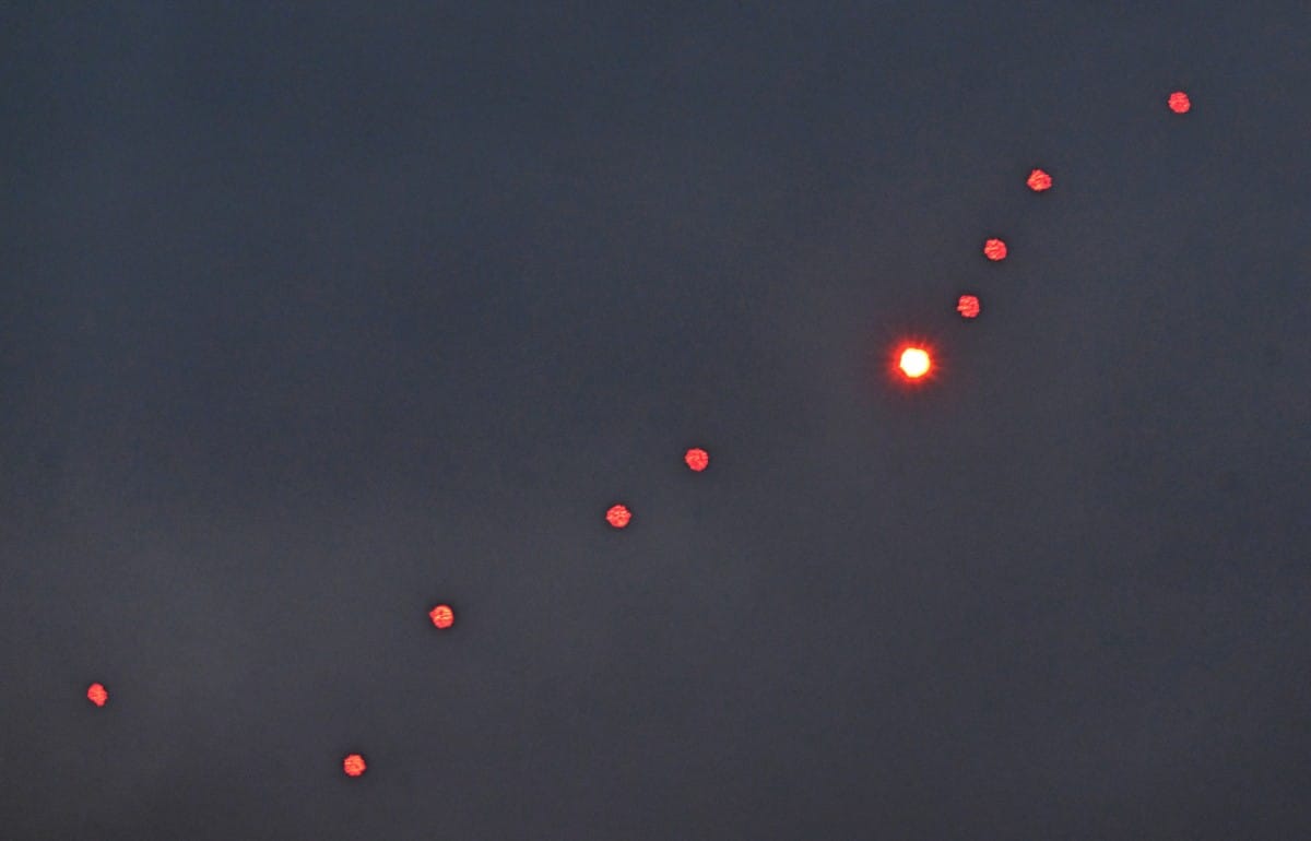 This photograph taken on December 27, 2025 shows Ukrainian air defence firing at drones during a Russian drones and missiles attack, in Kyiv.