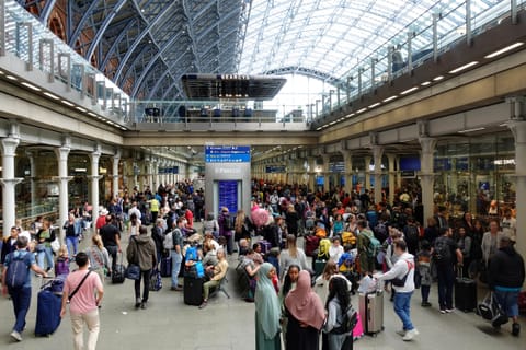 Rail travellers gather at the Eurostar terminal of St Pancras International railway station, London.