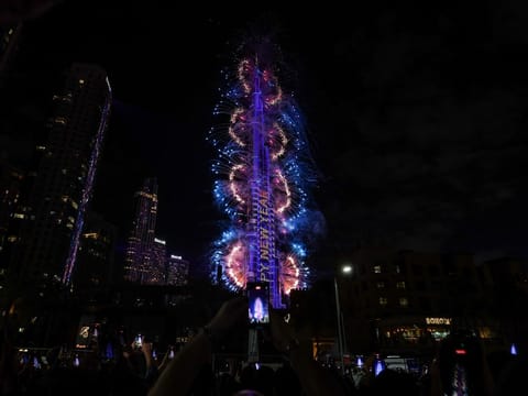 Fireworks light up the sky around the Burj Khalifa Tower, as the UAE welcomes in the New Year, in Dubai on January 1, 2026.