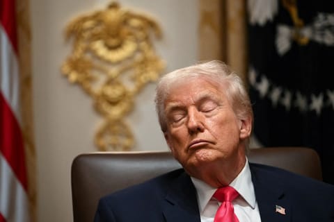 US President Donald Trump attends a cabinet meeting in the cabinet room of the White House in Washington, DC on December 2, 2025.
