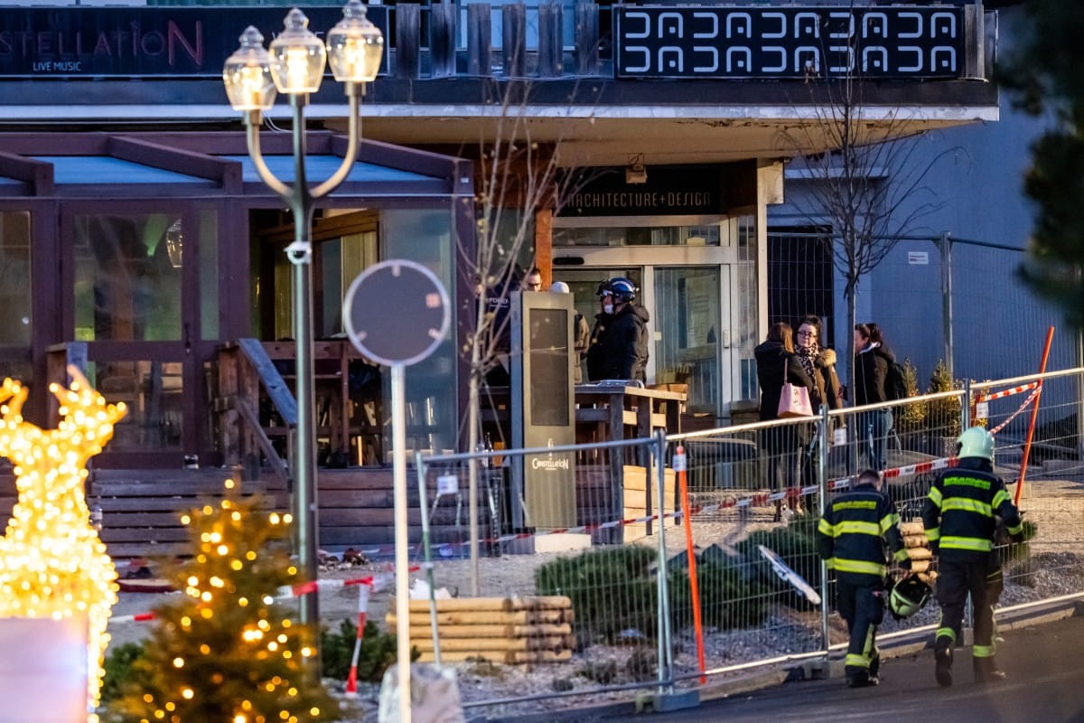 Rescuers are seen at the site of an explosion that ripped through a bar in Crans-Montana on January 1, 2026.