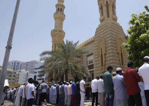 Worshippers gather at a mosque in Abu Dhabi for Friday prayers, which were held at 12.45 pm under the new nationwide schedule.