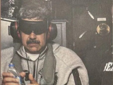 Trump posts photo of handcuffed, blindfolded Maduro