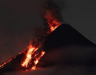 Philippines' Mayon Volcano: Eruption risk as superheated gases light the night sky
