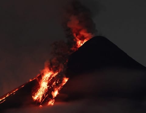 Philippines' Mayon Volcano: Eruption risk as superheated gases light the night sky