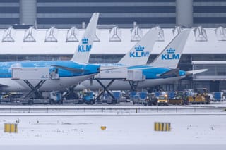 This photograph shows airplanes of Dutch airline KLM on the tarmac at Amsterdam Schiphol airport on January 7, 2026.