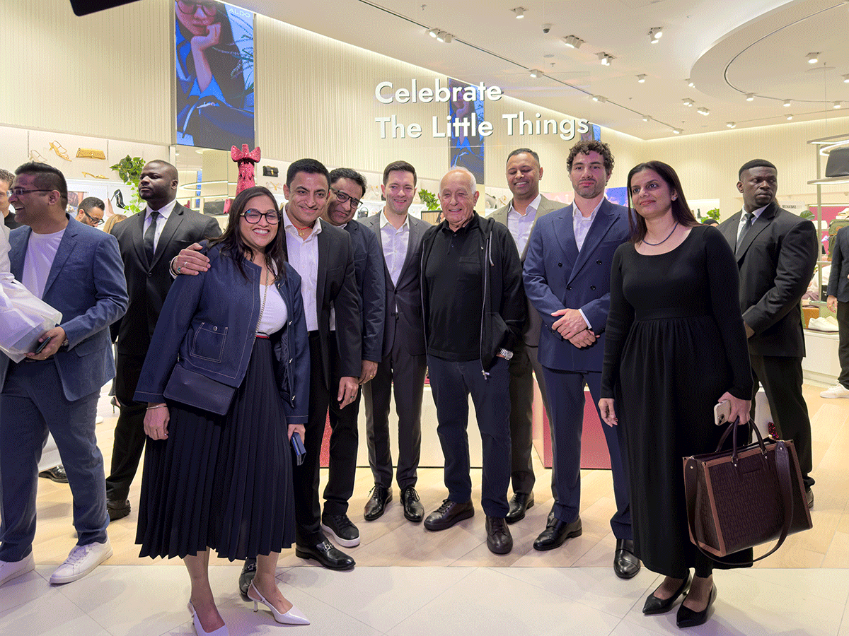 Aldo Bensadoun (C) with his Dubai team at the ALDO store in Dubai Mall.