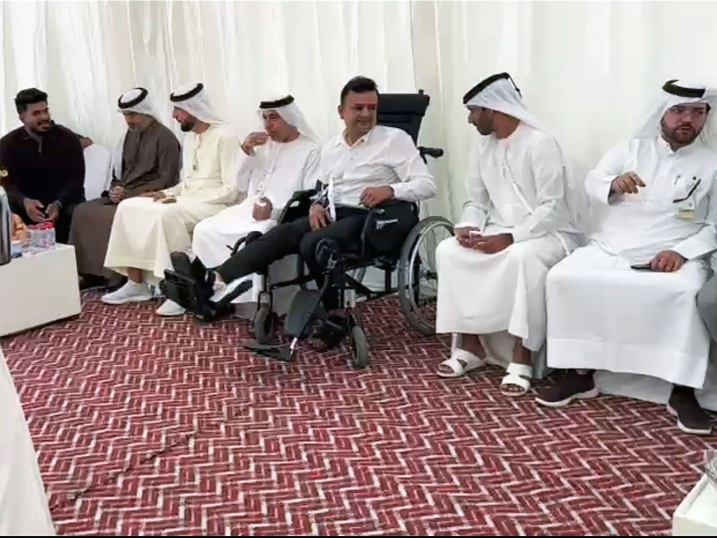 Still bearing injuries to his limbs from the accident, Abdul Latheef sat in a wheelchair with quiet dignity and accepted condolences and prayers. 