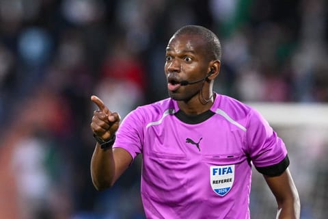 Senegal's referee Issa Sy reacts during the during the Africa Cup of Nations (CAN) quarter-final football match between Algeria and Nigeria at the Grand stadium in Marrakesh on January 10, 2026.