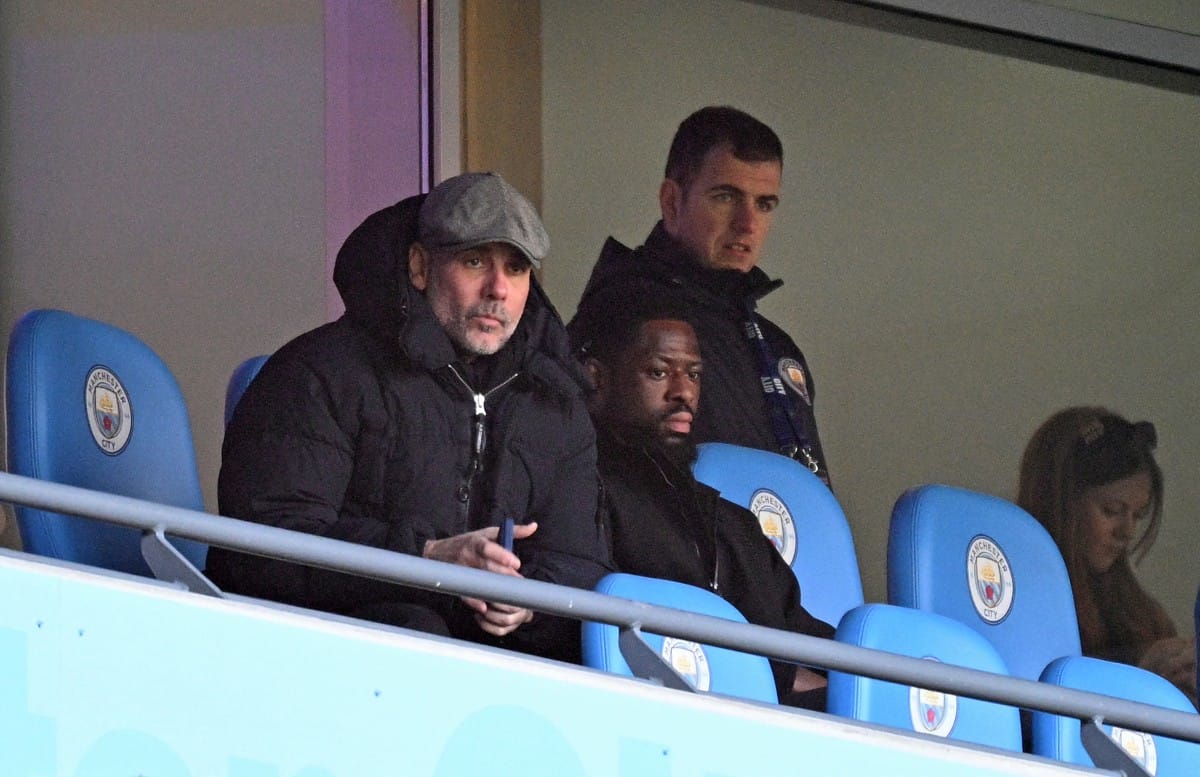 Manchester City's Spanish manager Pep Guardiola watches from the stands during the English FA Cup third round football match between Manchester City and Exeter City at the Etihad Stadium in Manchester, north west England, on January 10, 2026.