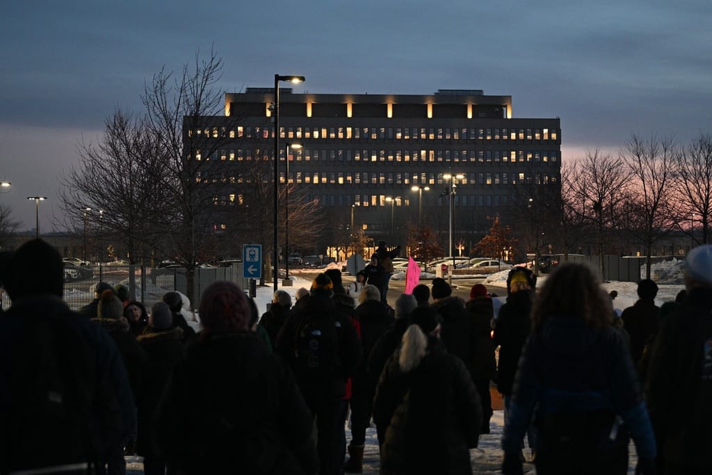 Protesters gather outside the Bishop Henry Whipple Federal Building, Thursday, Jan. 8, 2026, in Minneapolis, Minn.