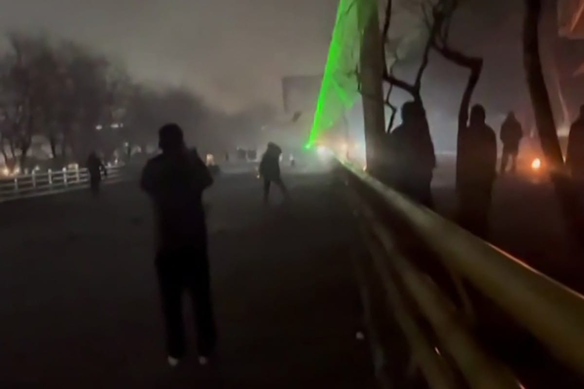 This video grab taken on January 13, 2026 from UGC images posted on social media on January 10, 2026 shows clashes in Mashhad, in northeastern Iran.